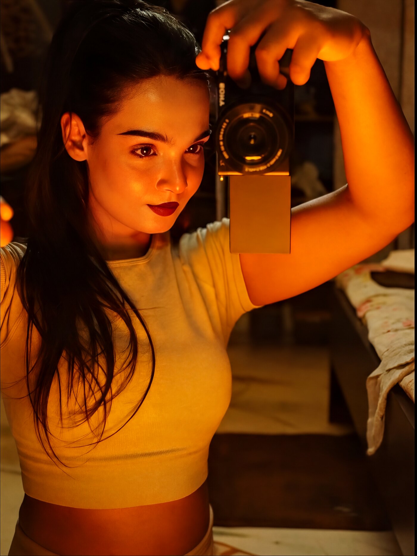Sony in hand, amber light. The other side of the lens.