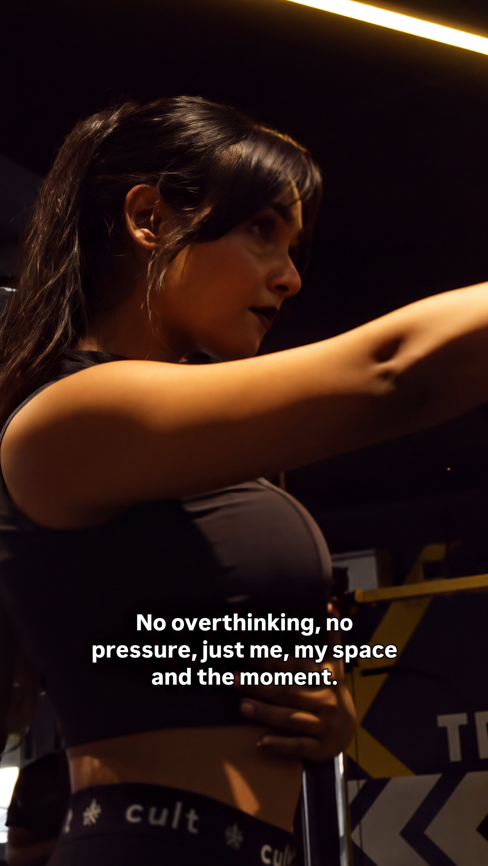 Dark training floor, intimate — coaching mode.